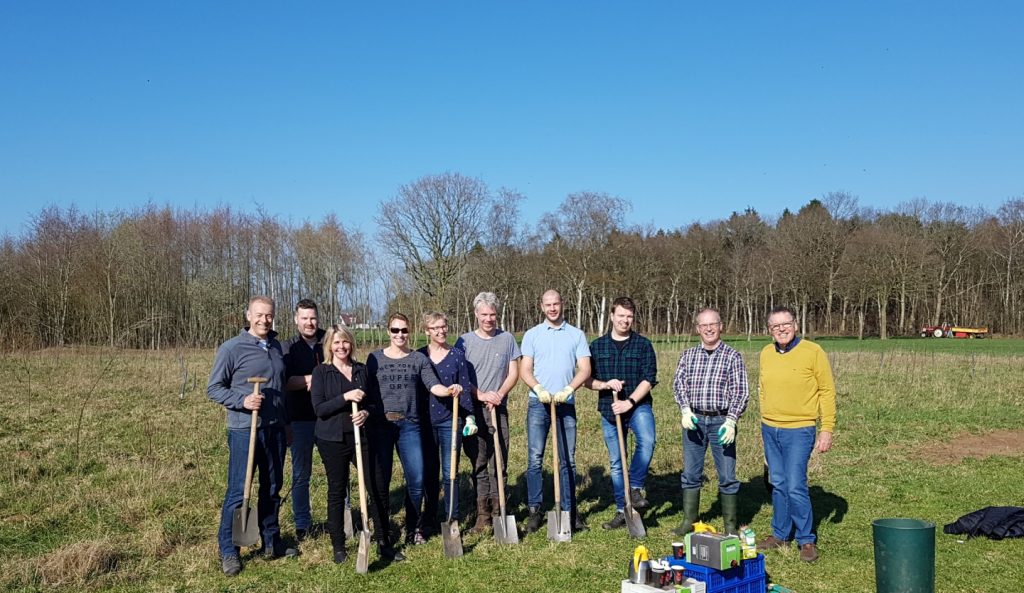 The team of Moving Spirits digging and planting trees 